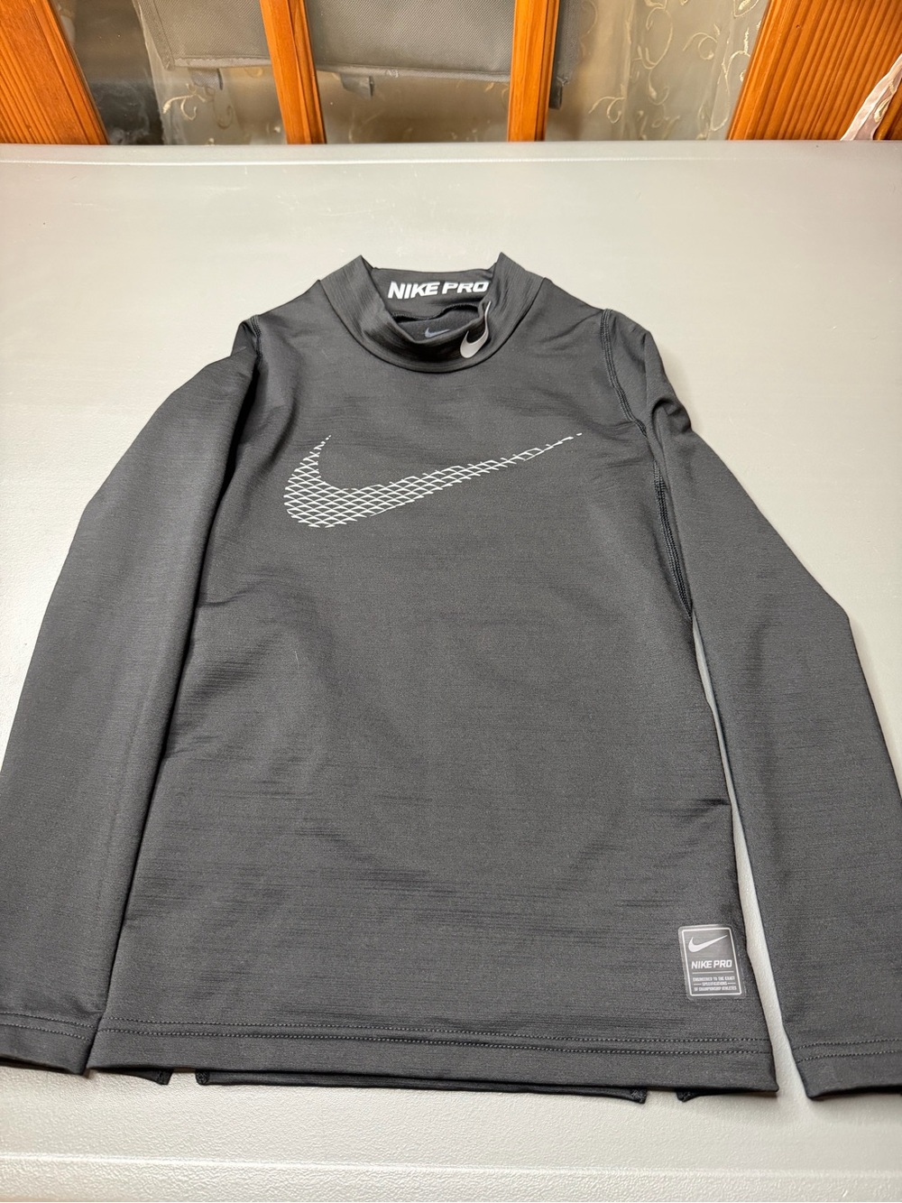 Kid’s Nike Pro Black Long Sleeve Compression Top. Size: Med